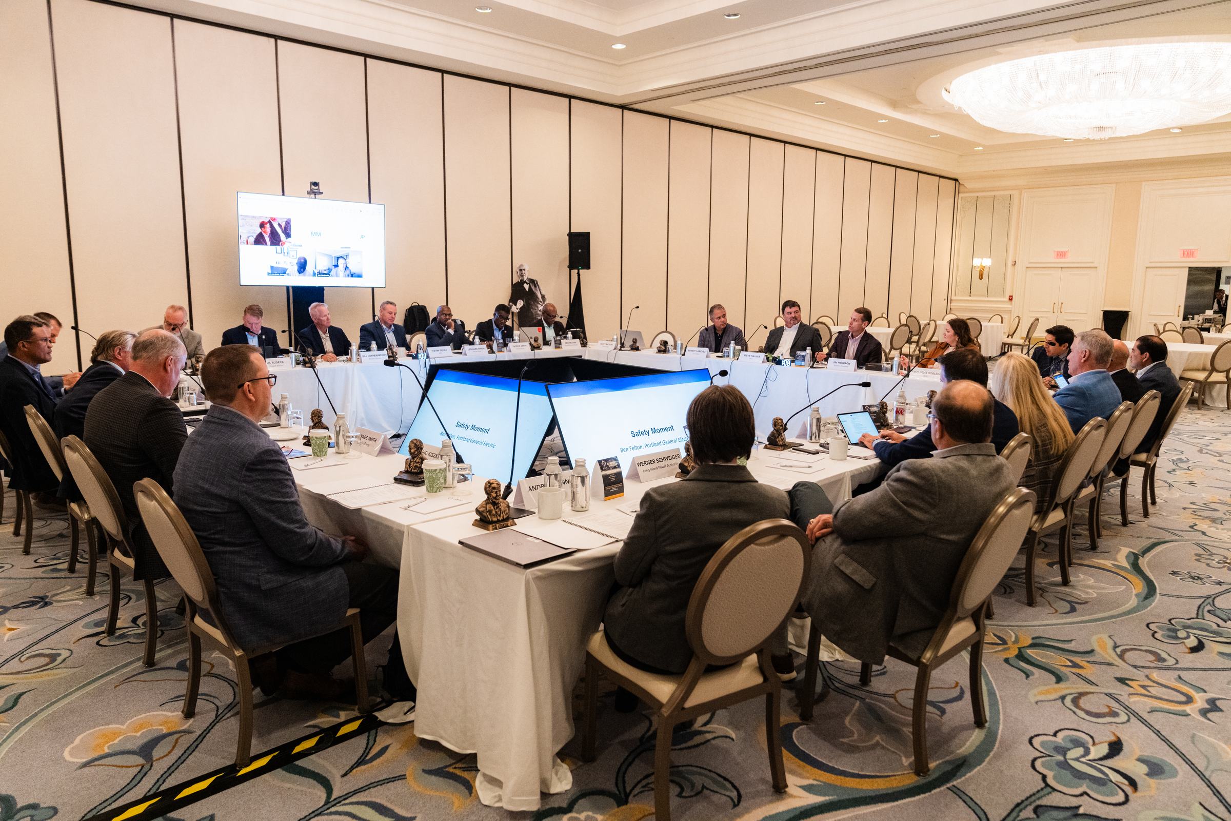 Utility professionals collaborating around a table